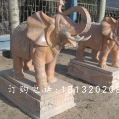 象鼻向上大象石雕，晚霞红大象雕塑