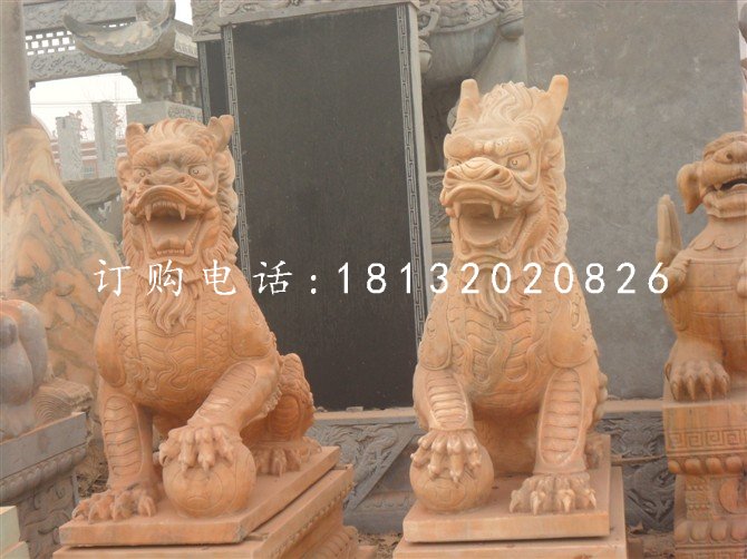 石雕踩球麒麟晚霞红神兽雕塑